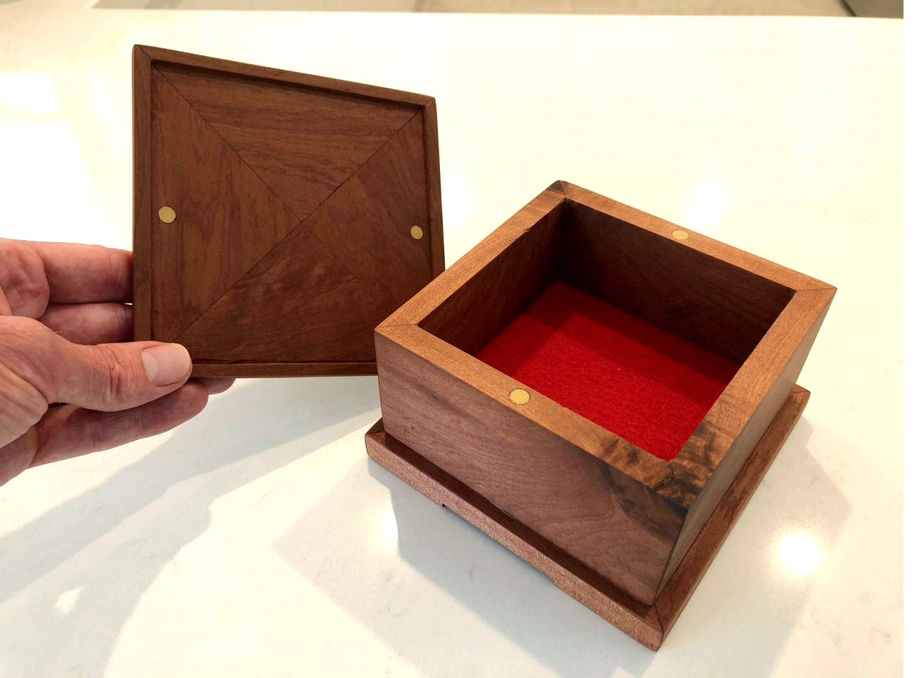 Tasmanian myrtle box open with parquetry lid and red felt interior